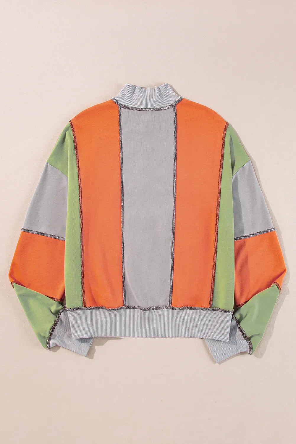 Andrea® | Full size long sleeve sweatshirt with exposed seams and color block pattern