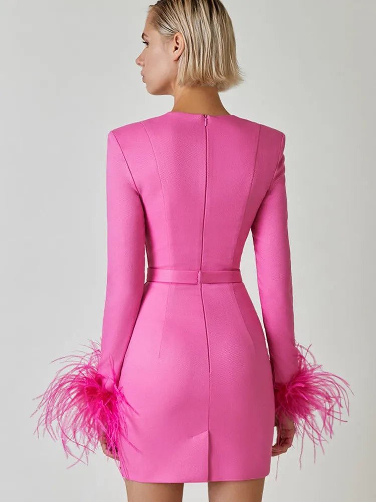 Amara® | Long sleeve mini bandage dress with feathers in pink and black