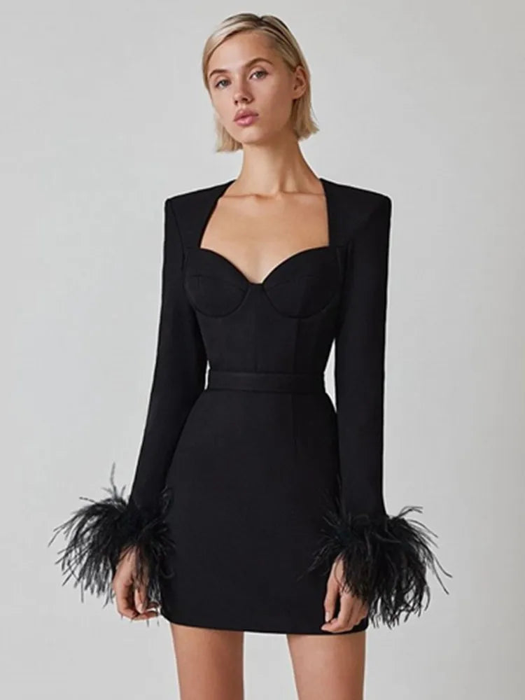 Amara® | Long sleeve mini bandage dress with feathers in pink and black